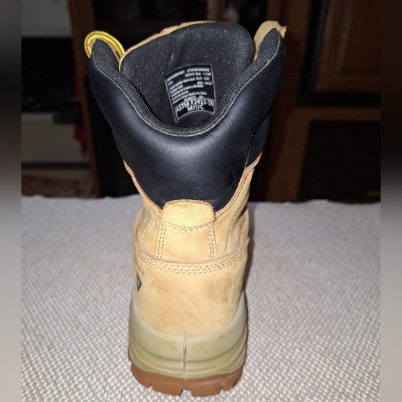 A pair of Herman Survivors leather boots in a men's size 11.5 Wide. Safety Toe. - Picture 4 of 12